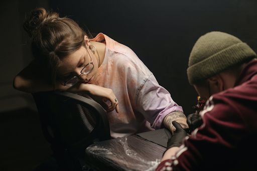 artist working in a tattoo shop1 successful tattoo artist working in a tattoo shop