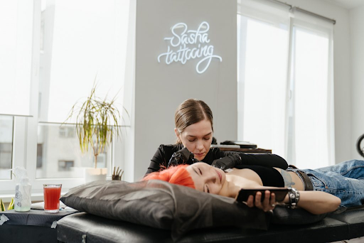 Person getting a tattoo Person getting a tattoo