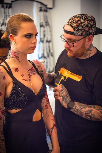 Tattoos being applied to Cara Delevigne for Met Gala Tattoos being applied to Cara Delevigne for Met Gala